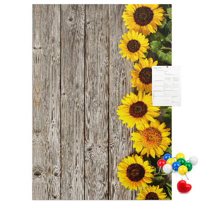 Decoración pizarra de corcho Girasoles sobre un fondo de tabla de madera