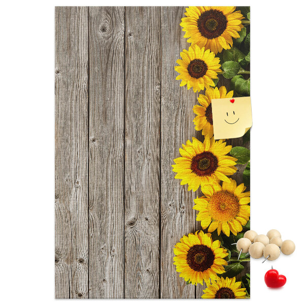 Decoración pizarra de corcho Girasoles sobre un fondo de tabla de madera
