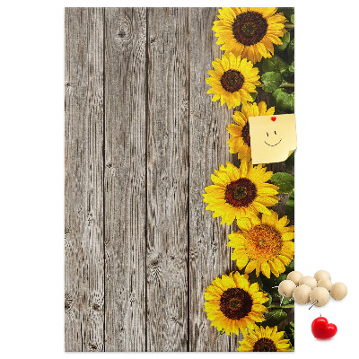 Decoración pizarra de corcho Girasoles sobre un fondo de tabla de madera