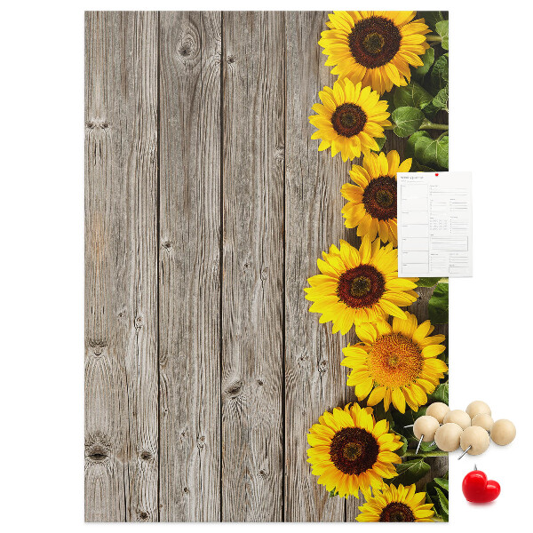 Decoración pizarra de corcho Girasoles sobre un fondo de tabla de madera