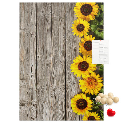 Decoración pizarra de corcho Girasoles sobre un fondo de tabla de madera