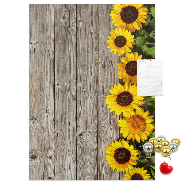 Decoración pizarra de corcho Girasoles sobre un fondo de tabla de madera