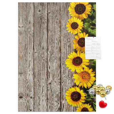 Decoración pizarra de corcho Girasoles sobre un fondo de tabla de madera