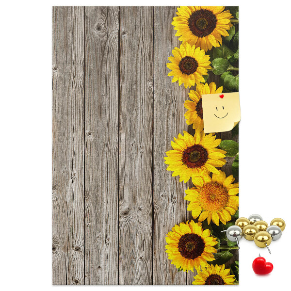 Decoración pizarra de corcho Girasoles sobre un fondo de tabla de madera