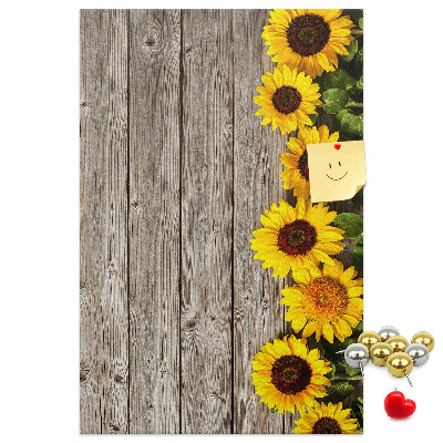 Decoración pizarra de corcho Girasoles sobre un fondo de tabla de madera