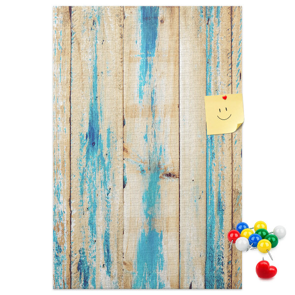 Decoración pizarra de corcho Panel de madera antiguo con detalles azules.