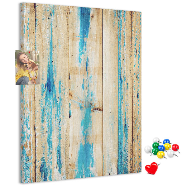 Decoración pizarra de corcho Panel de madera antiguo con detalles azules.