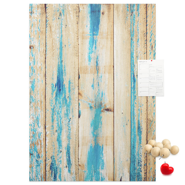 Decoración pizarra de corcho Panel de madera antiguo con detalles azules.