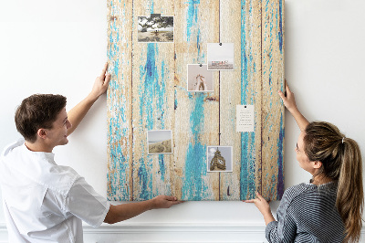 Decoración pizarra de corcho Panel de madera antiguo con detalles azules.