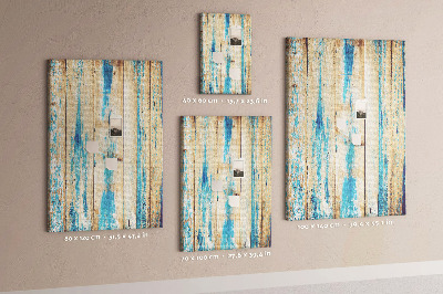 Decoración pizarra de corcho Panel de madera antiguo con detalles azules.