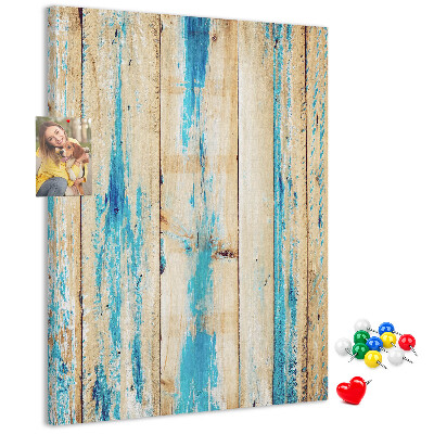 Decoración pizarra de corcho Panel de madera antiguo con detalles azules.