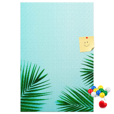 Tablero de corcho para pared Hojas tropicales sobre un fondo azul