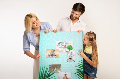 Tablero de corcho para pared Hojas tropicales sobre un fondo azul
