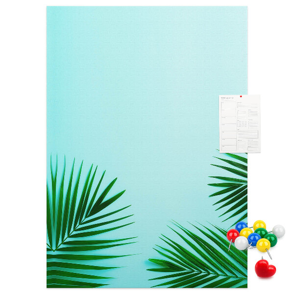 Tablero de corcho para pared Hojas tropicales sobre un fondo azul