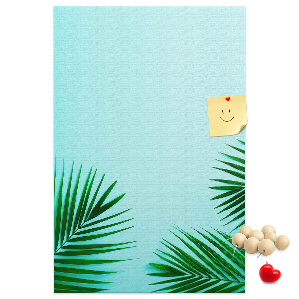 Tablero de corcho para pared Hojas tropicales sobre un fondo azul