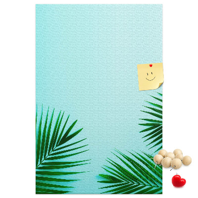 Tablero de corcho para pared Hojas tropicales sobre un fondo azul