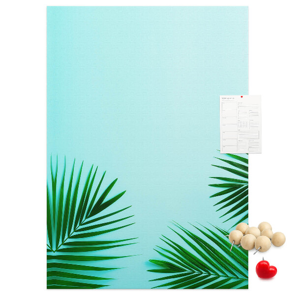 Tablero de corcho para pared Hojas tropicales sobre un fondo azul