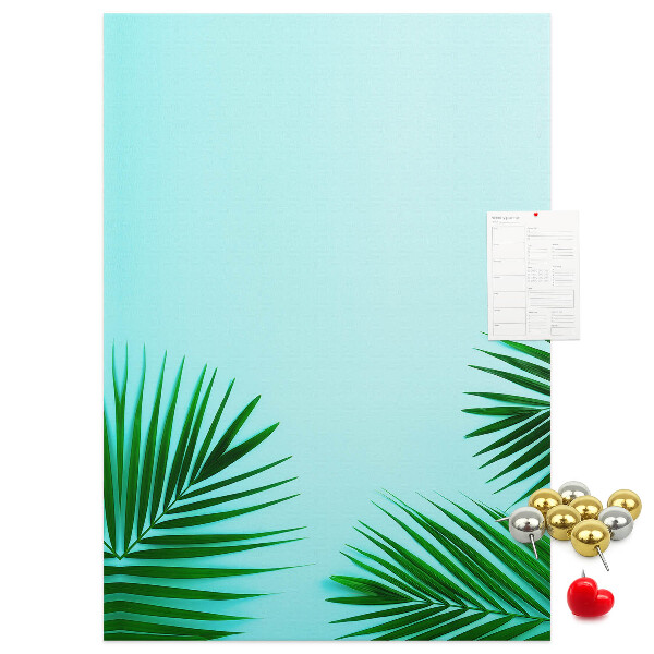 Tablero de corcho para pared Hojas tropicales sobre un fondo azul