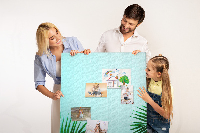 Tablero de corcho para pared Hojas tropicales sobre un fondo azul