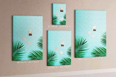 Tablero de corcho para pared Hojas tropicales sobre un fondo azul
