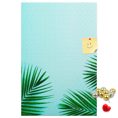 Tablero de corcho para pared Hojas tropicales sobre un fondo azul