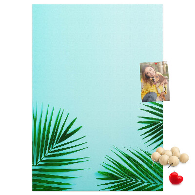 Tablero de corcho para pared Hojas tropicales sobre un fondo azul