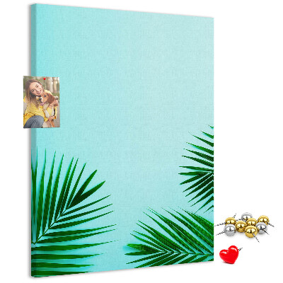 Tablero de corcho para pared Hojas tropicales sobre un fondo azul