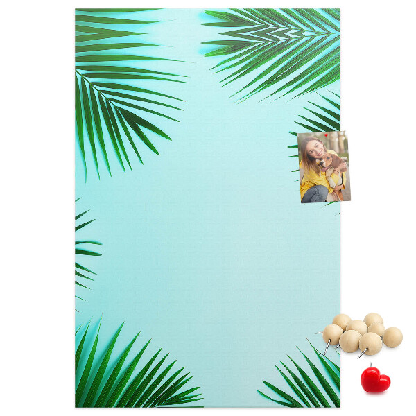 Tablón de corcho Hojas de palmera sobre un fondo azul