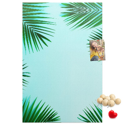 Tablón de corcho Hojas de palmera sobre un fondo azul