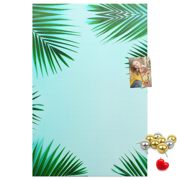Tablón de corcho Hojas de palmera sobre un fondo azul