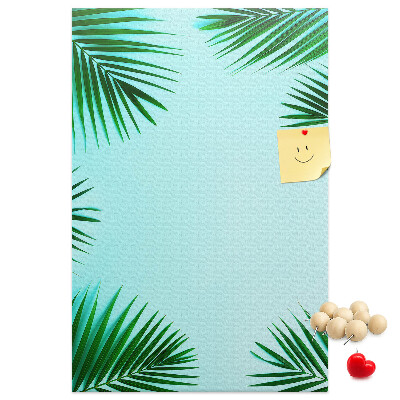Tablón de corcho Hojas de palmera sobre un fondo azul
