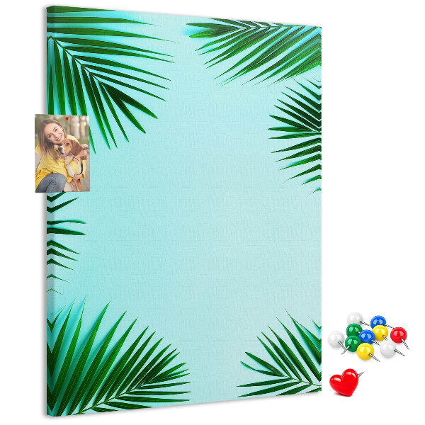 Tablón de corcho Hojas de palmera sobre un fondo azul