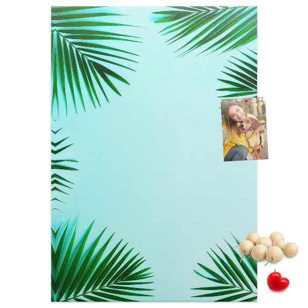 Tablón de corcho Hojas de palmera sobre un fondo azul