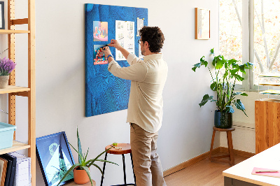 Decoración pizarra de corcho Plumas azules en la luz suave