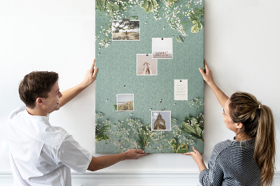 Pizarra de corcho decorativa fondo verde con flores y hojas delicadas