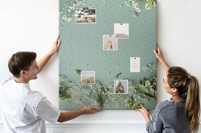 Pizarra de corcho decorativa fondo verde con flores y hojas delicadas