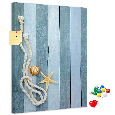 Tablero de corcho para pared Ambiente costero con tablones azules y una concha.