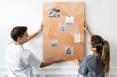 Tablero de corcho para pared con diseño geométrico en tonos naranja y beige