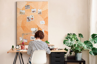 Tablero de corcho para pared con diseño geométrico en tonos naranja y beige