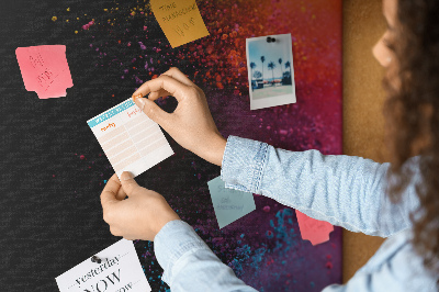 Pizarra de corcho decorativa con diseño de explosiones coloridas sobre fondo negro