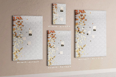 Tablón de corcho Estrellas doradas y plateadas sobre fondo gris.