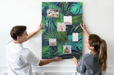 Pizarra de corcho decorativa diseño de hojas tropicales sobre fondo oscuro