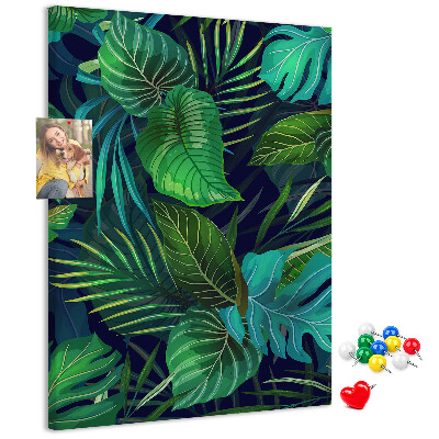 Pizarra de corcho decorativa diseño de hojas tropicales sobre fondo oscuro