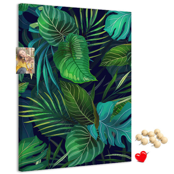 Pizarra de corcho decorativa diseño de hojas tropicales sobre fondo oscuro