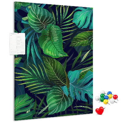 Pizarra de corcho decorativa diseño de hojas tropicales sobre fondo oscuro
