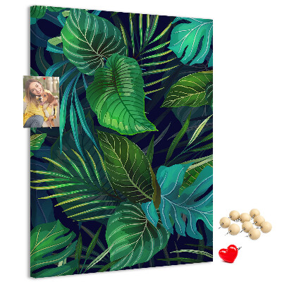 Pizarra de corcho decorativa diseño de hojas tropicales sobre fondo oscuro