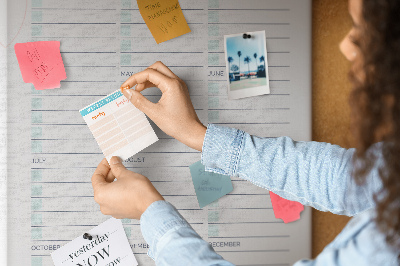 Tablero de corcho Agenda mensual con detalles coloridos.