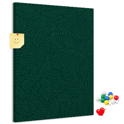 Decoración pizarra de corcho Fondo con hojas sobre un fondo verde oscuro