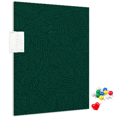 Pizarra de corcho decorativa con diseño de hojas sobre fondo verde oscuro