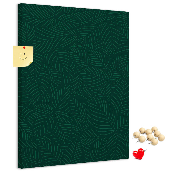 Pizarra de corcho decorativa con diseño de hojas sobre fondo verde oscuro